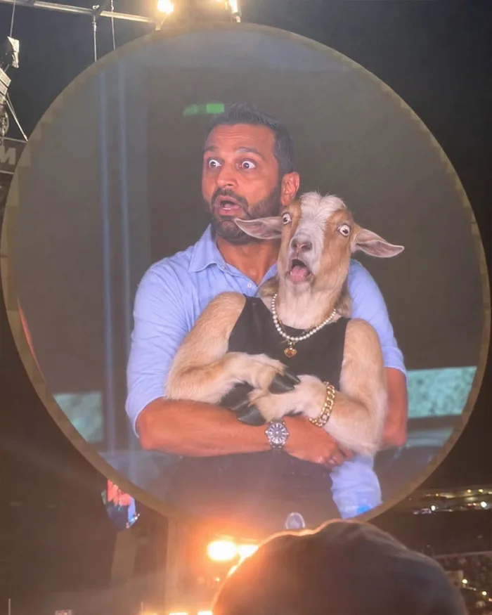 Viral Image Shows Man Holding a Dressed-Up Goat