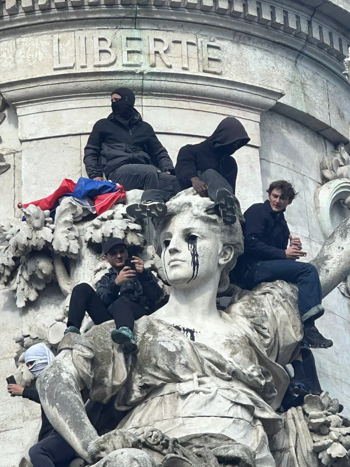 Protesters Gather Atop Monument in France