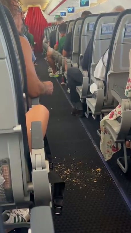 Passenger Caught Littering on Airplane Floor