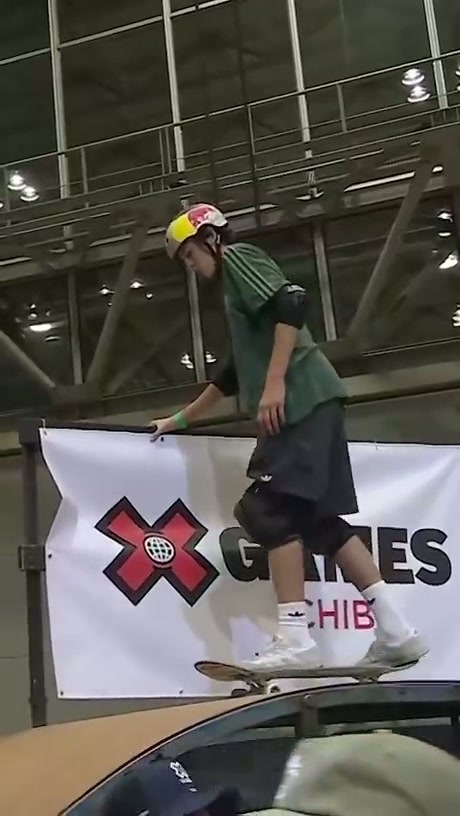 Skateboarder Executes High-Difficulty Aerial Trick on Halfpipe
