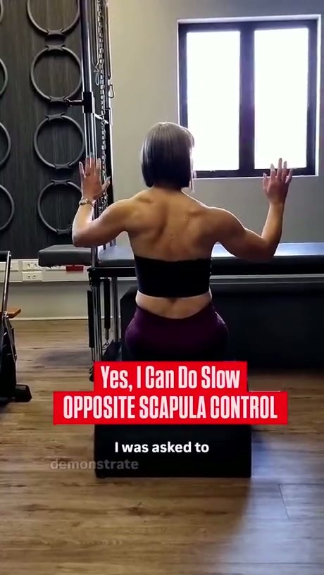 Pilates Instructor Demonstrates Precise Back Muscle Control