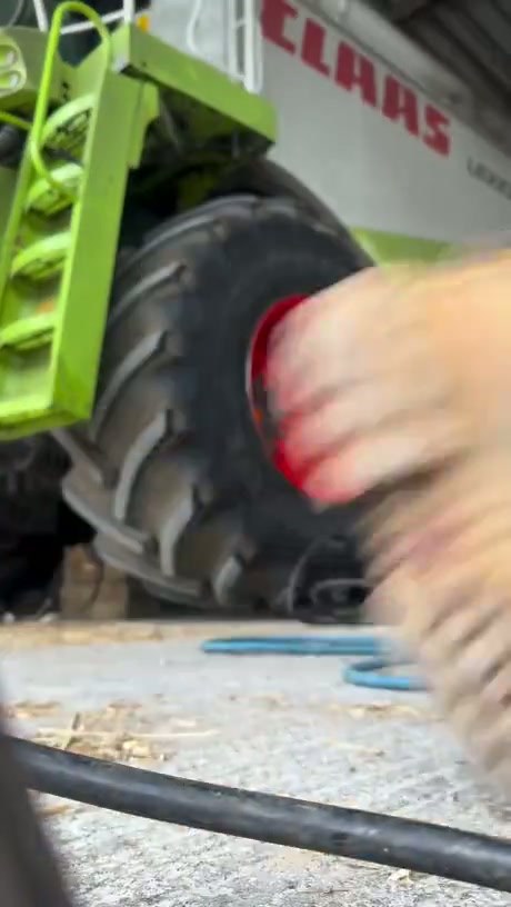 Manual Tire Maintenance on a Claas Lexion Combine Harvester
