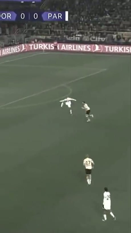 Professional Footballers Execute High-Stakes Defensive Maneuvers