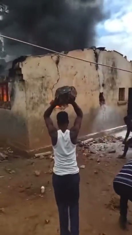 Locals Attempt to Extinguish Building Fire Using Dirt