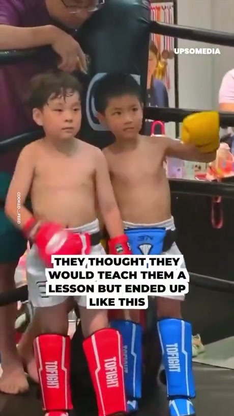 Young Children Spar in Boxing Ring