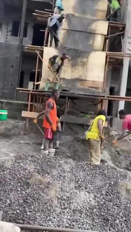 Construction Crew Uses Human Chain to Move Wet Concrete