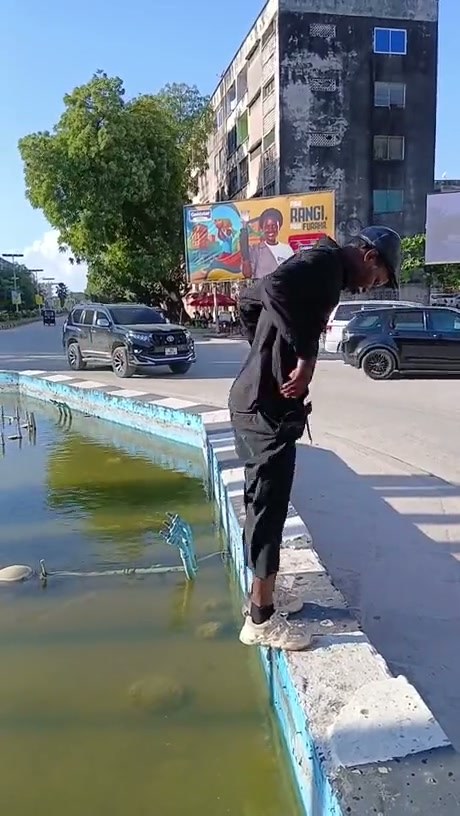 Man Performs Impressive High-Jump Stunts Over Water Buckets