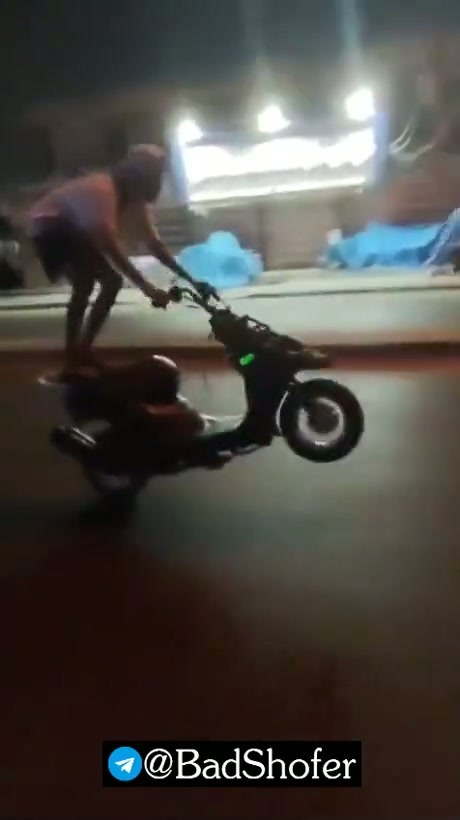 Motorcyclist Collides with Car While Performing Stunt