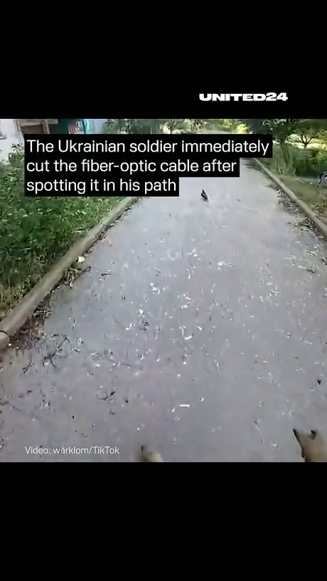 Ukrainian Soldier Cuts Fiber-Optic Cable Found on Path